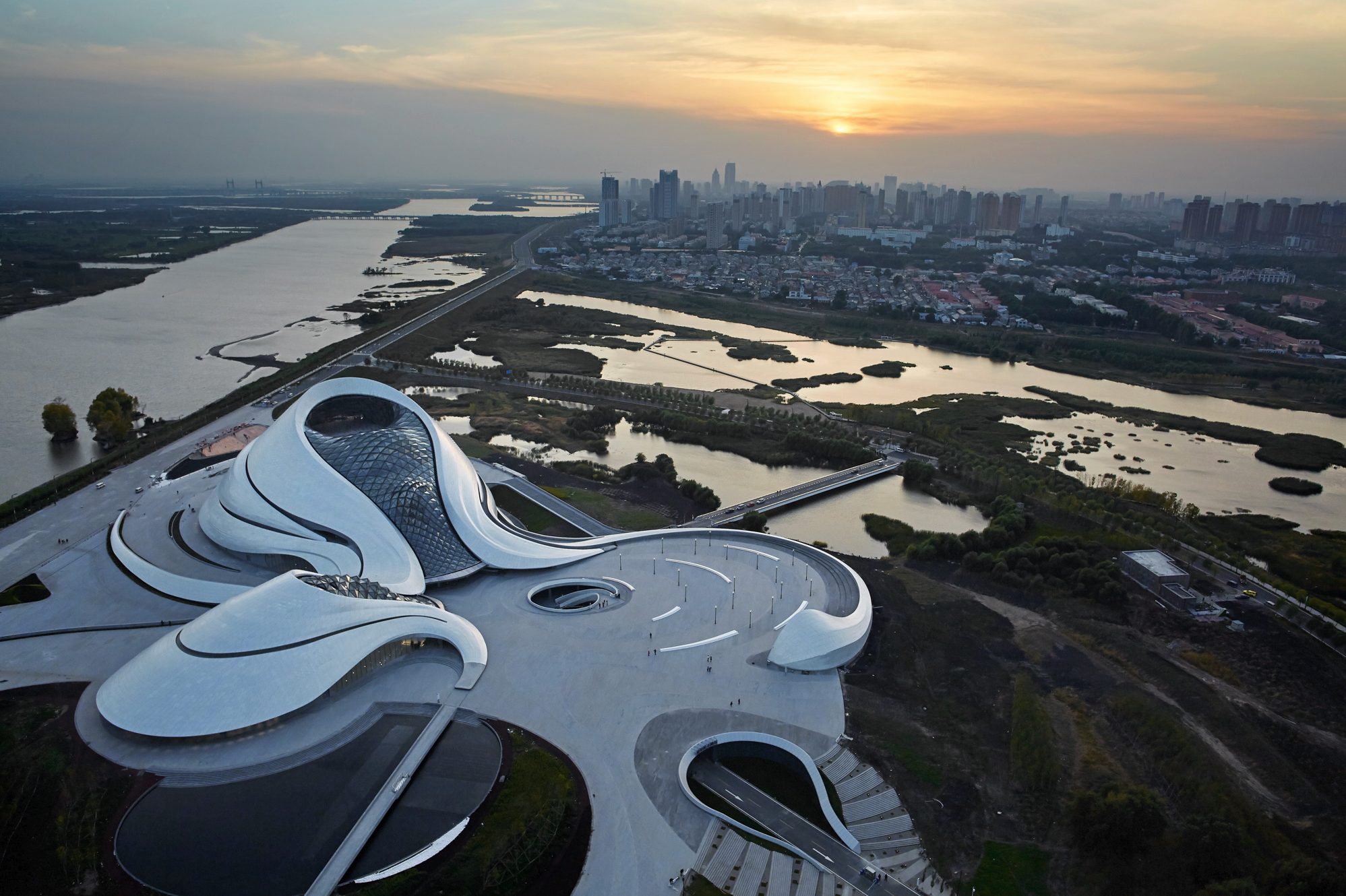 Harbin Opera House from above, curving along the Songhua River wetlands