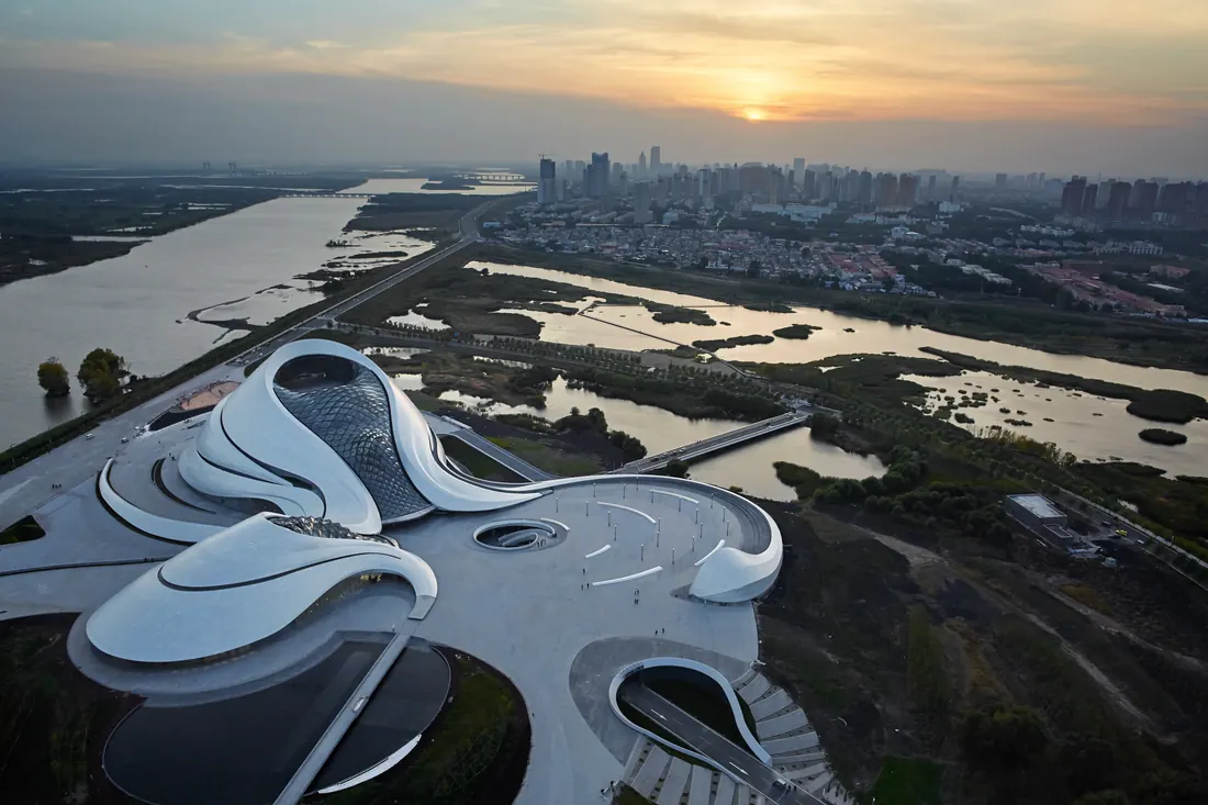Harbin Opera House from above, curving along the Songhua River wetlands
